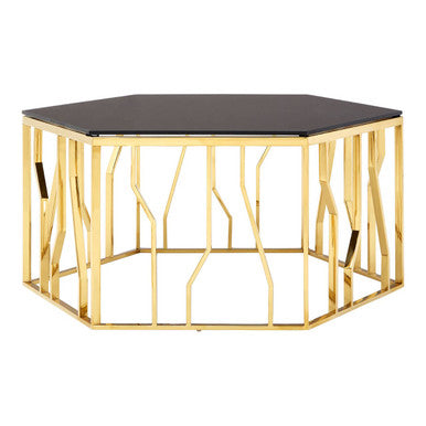 Hexagonal table with gold metal frame and black glass top on a white background