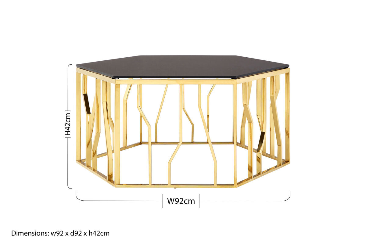 Hexagonal table with gold metal frame and black top, showing dimensions on a white background.
