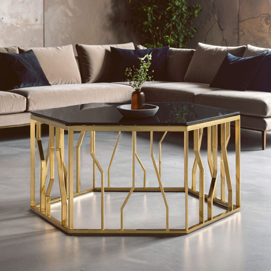 Modern living room with a gold coffee table and sectional sofa.