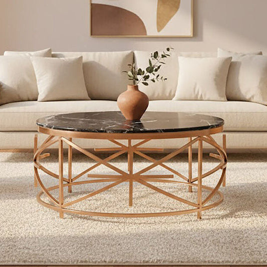 Alvaro black marble round coffee table with rose gold finish frame, styled living room