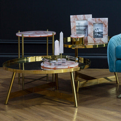 Gold coffee table with marble top in a room setting