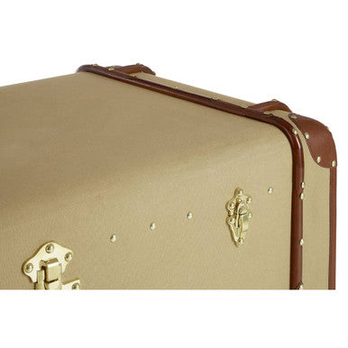 Beige suitcase with brown trim and gold hardware on a white background