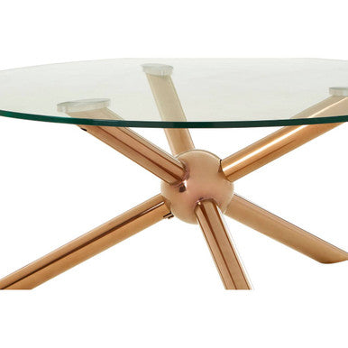 Glass dining table with bronze metal base on a white background