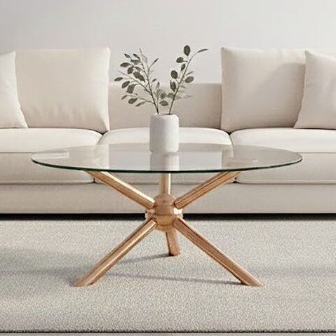 Glass coffee table with wooden base in front of a beige sectional sofa.