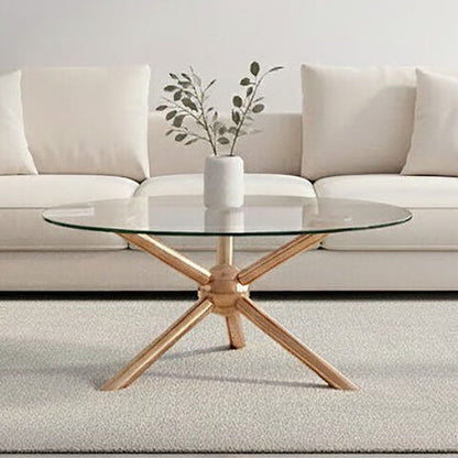 Glass coffee table with wooden base in front of a beige sectional sofa.