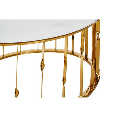 Gold curved console table with white marble top on a white background