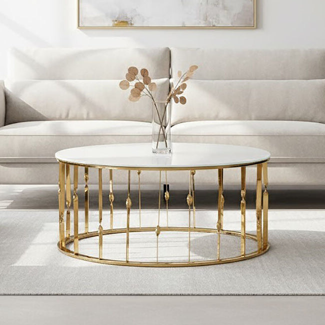 Gold coffee table with marble top in a living room setting