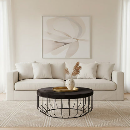 Kensington Townhouse black hair on hide round coffee table, styled living room