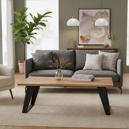 Live edge acacia wood coffee table with black iron legs, styled living room