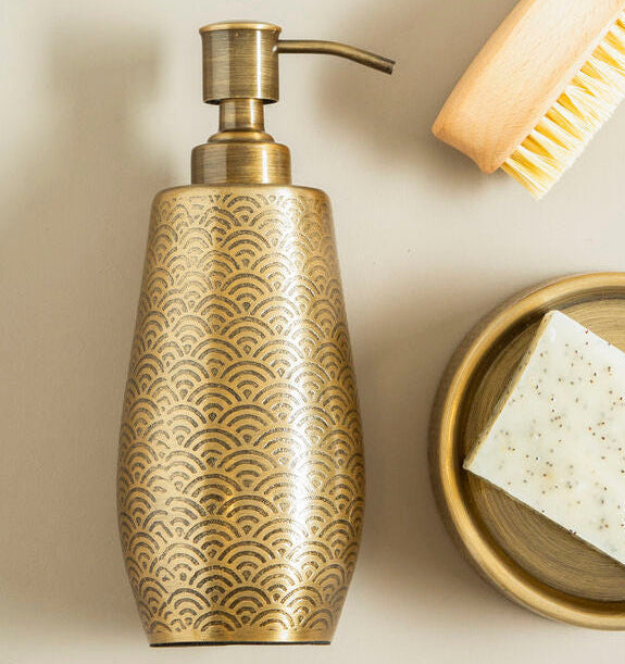 Allegra Champagne Etched Soap Dispenser styled on a vanity