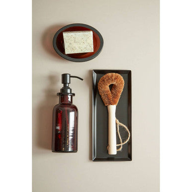 Allegra Kiara Brown Glass Soap Dispenser styled on a vanity