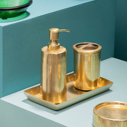 Allegra Gold Line Effect Soap Dispenser styled on a vanity