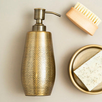 Allegra Gold Etched Soap Dispenser styled on a vanity