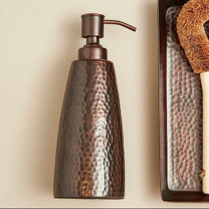 Allegra Dark Bronze Hammered Effect Soap Dispenser styled on a vanity