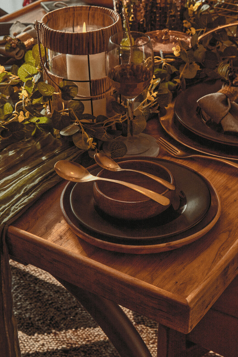 Round acacia wood plate used as a decorative centrepiece