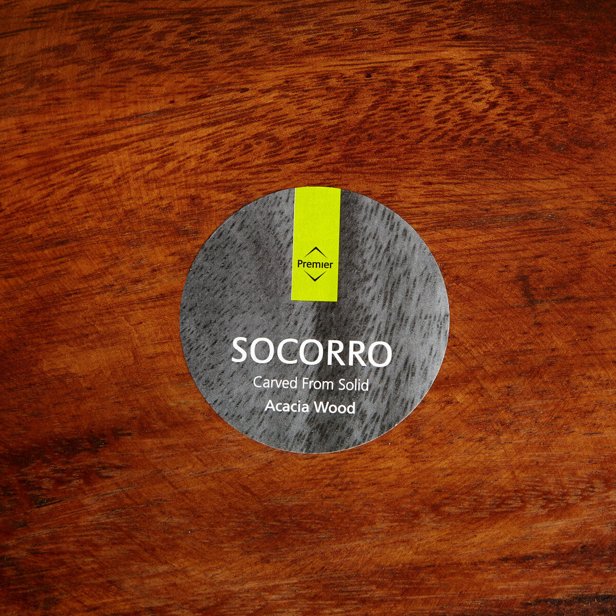 Kora acacia wood serving plate shown in its packaging