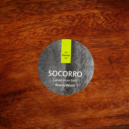 Kora acacia wood serving plate shown in its packaging