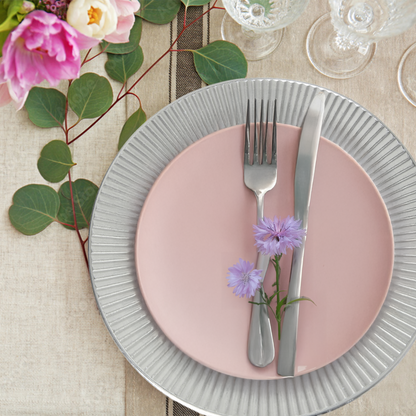 Silver Redbud charger plate styled on a dining table