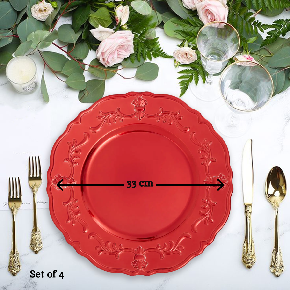 Red baroque charger plate styled with glassware and cutlery on a dining table