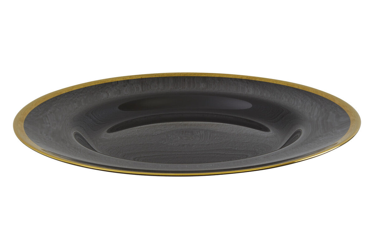 Black glass charger plates arranged together showing the matching set