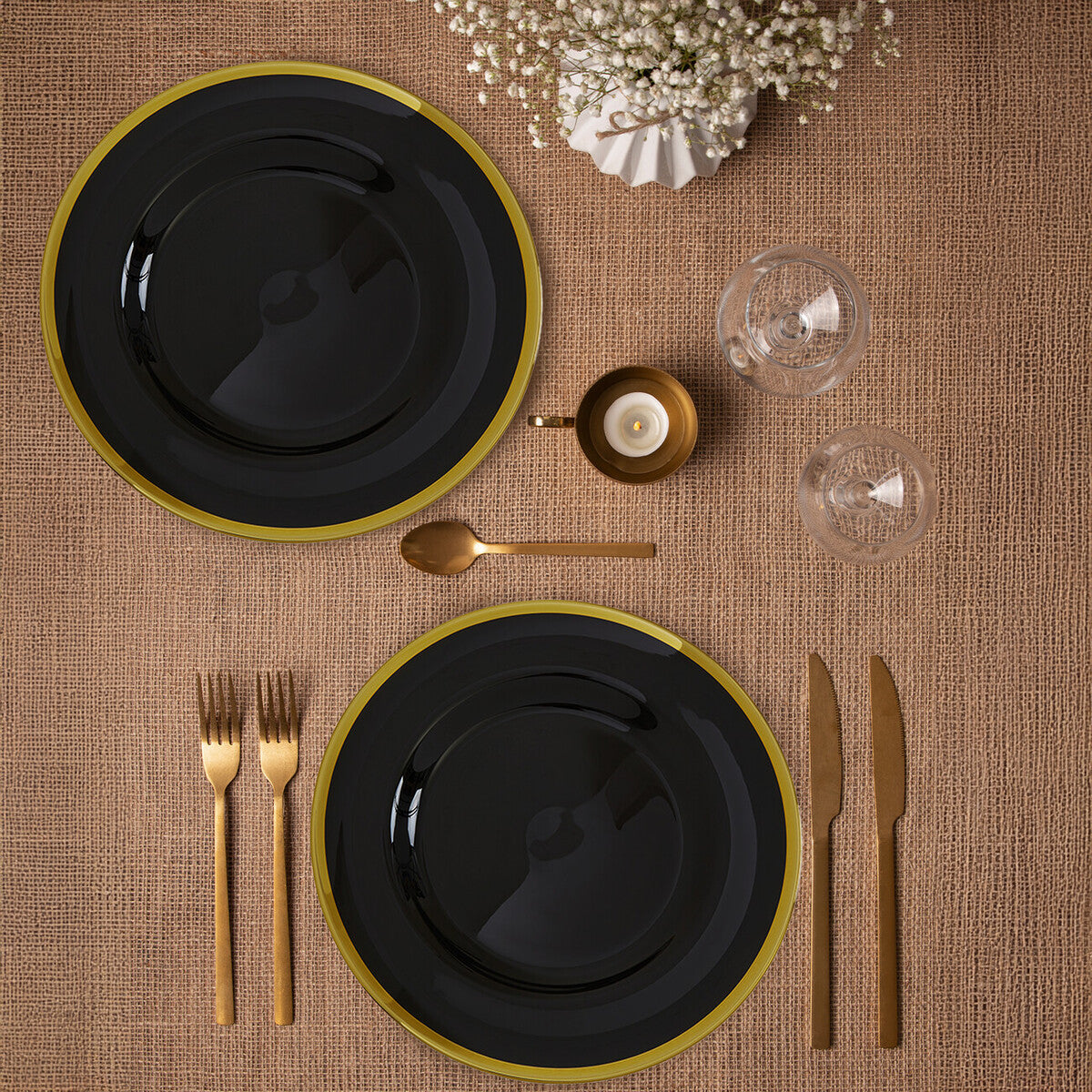 Set of four black glass charger plates with gold rim, 33cm