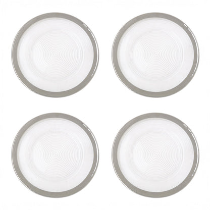Clear glass charger plates stacked showing the embossed spiral texture