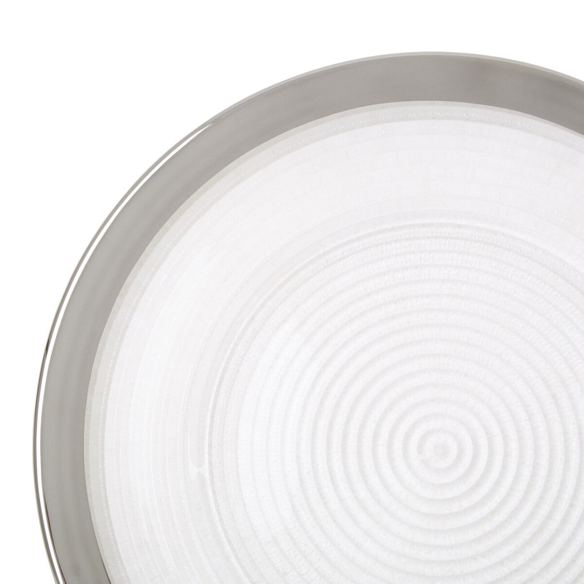 Close-up detail of the embossed spiral texture on the glass charger plate