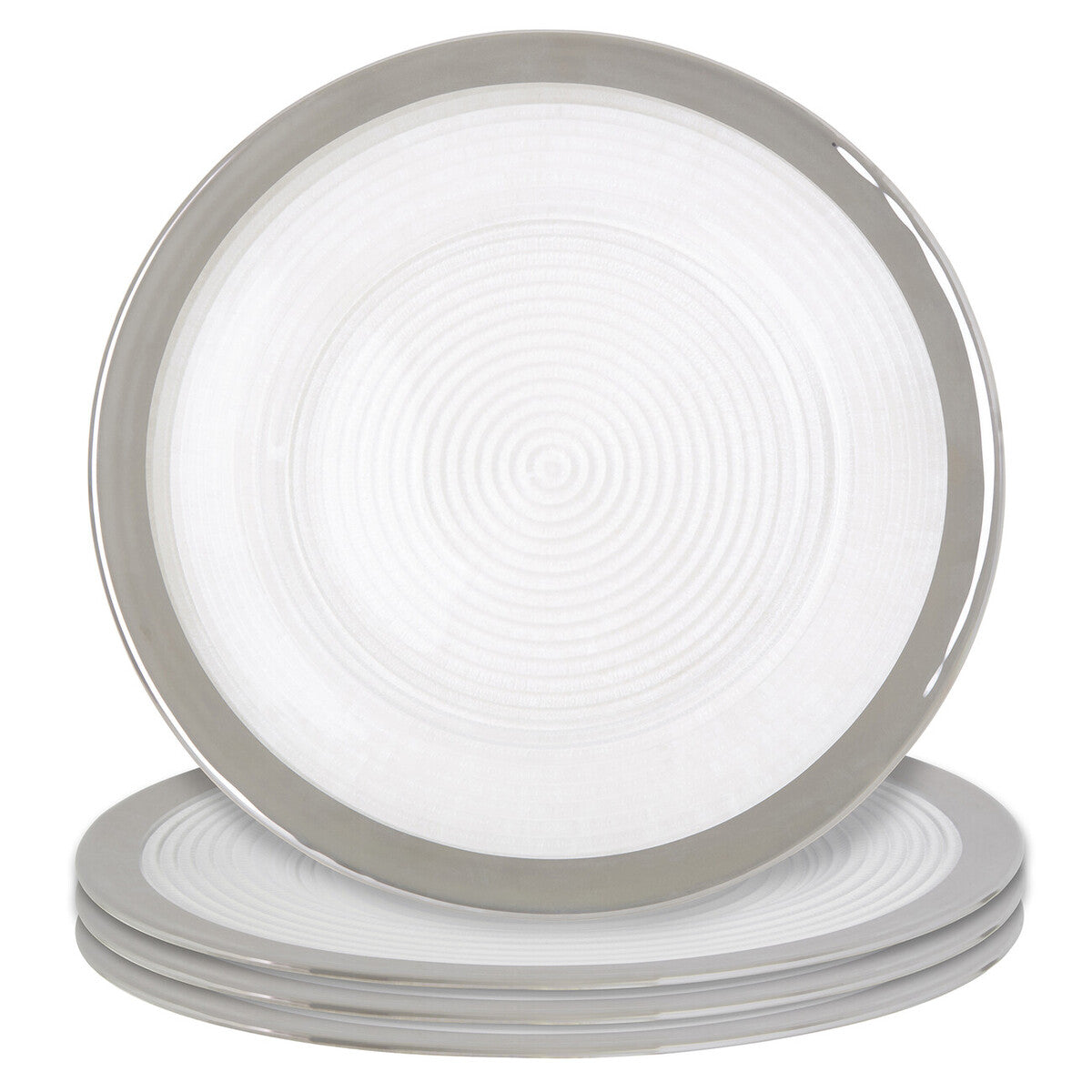 Four glass charger plates styled across a dining table setting