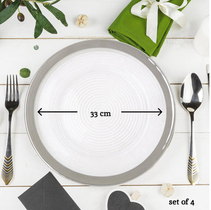 Glass charger plates arranged together showing the matching set