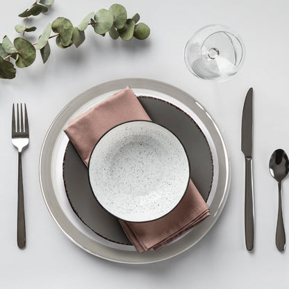 Embossed glass charger plate shown from above with spiral texture visible