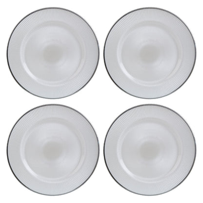 White glass charger plates stacked showing the embossed texture