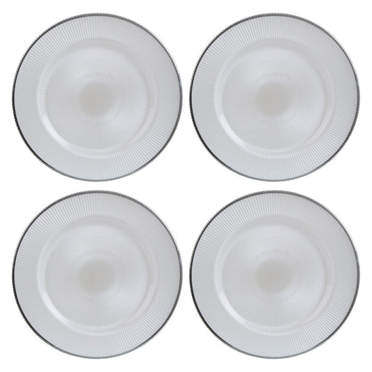 White glass charger plates stacked showing the embossed texture