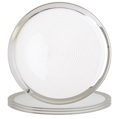 Glass coupe charger plates styled with tableware for a formal dinner