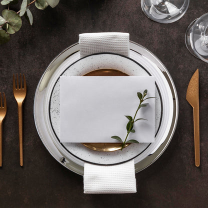 Set of four embossed glass coupe charger plates with silver rim, 32cm