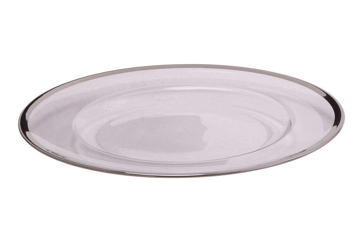 Glass charger plates styled with tableware for a formal dinner