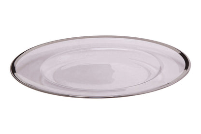 Glass charger plates styled with tableware for a formal dinner