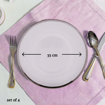 Glass charger plates arranged together showing the matching set