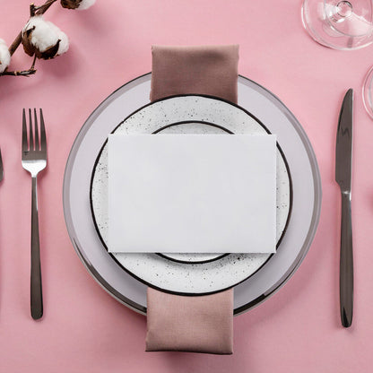 Glass charger plate with silver rim shown from above