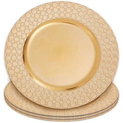 Gold charger plates arranged together showing the matching set