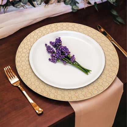 Gold charger plates stacked showing the octagonal rim pattern