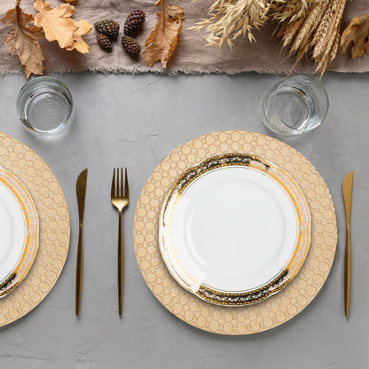 Four gold octagon rim charger plates styled across a dining table