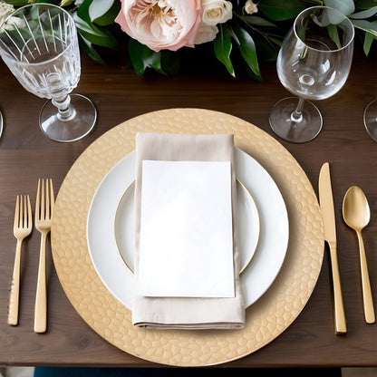 Gold charger plate with hammered rim shown from above