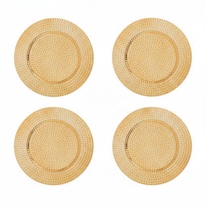 Set of four gold hammered charger plates, 33cm diameter