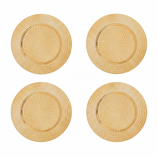Set of four gold hammered charger plates, 33cm diameter