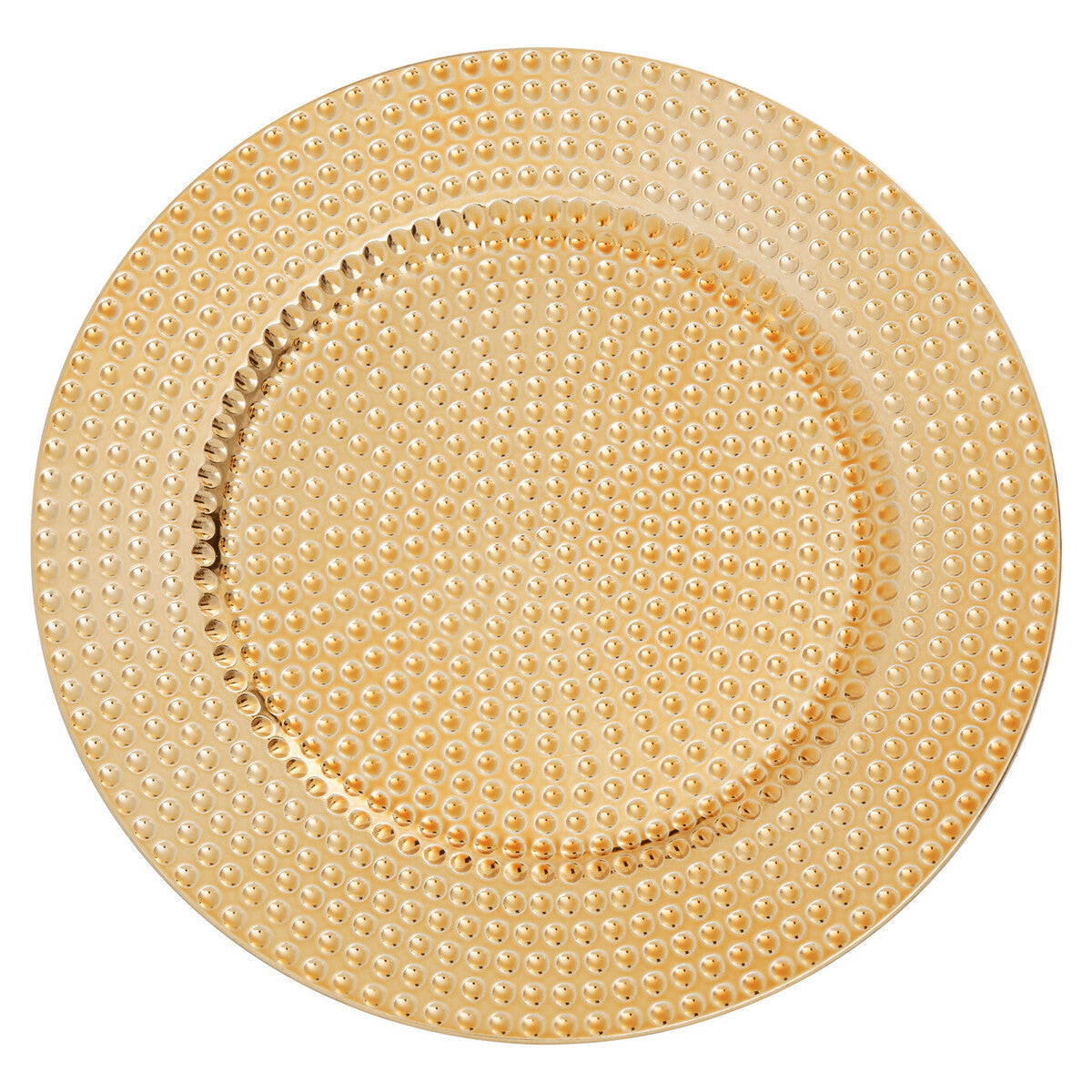 Gold hammered charger plate laid beneath a dinner plate in a place setting