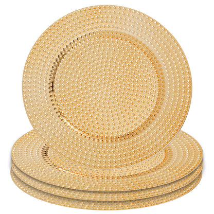 Close-up detail of the hammered texture on the gold charger plate