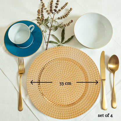 Gold hammered charger plates arranged together showing the matching set