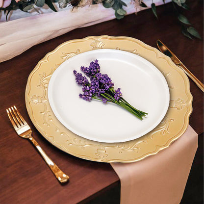 Gold baroque charger plates stacked showing the scrollwork detail