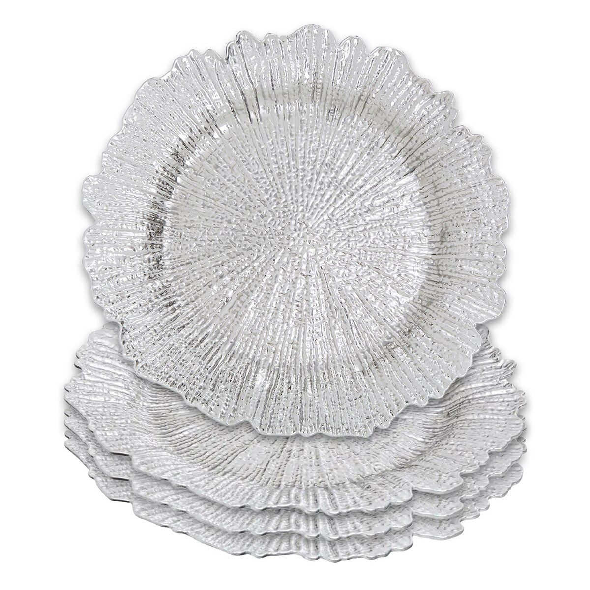 Silver reef charger plates styled with tableware for a formal dinner