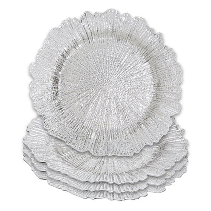 Silver reef charger plates styled with tableware for a formal dinner